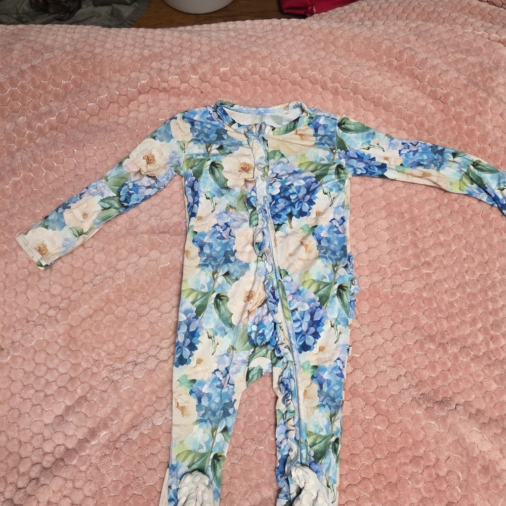 Once in a Blue BloomThis is the Melinda Criss-Cross Romper by Posh Peanut. The r